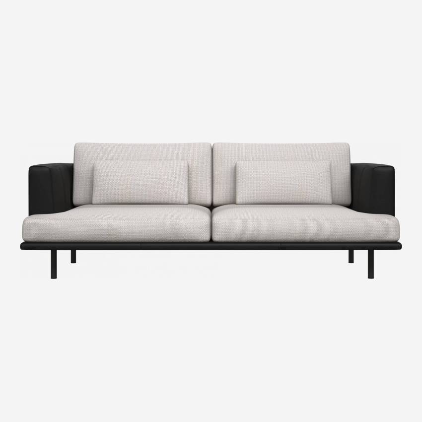 3 seater sofa in Fasoli fabric, snow white with base and armrests in black leather