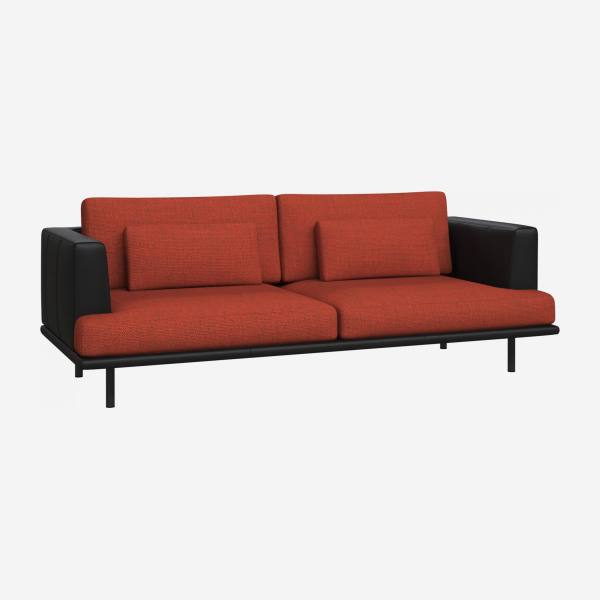 3 seater sofa in Fasoli fabric, warm red rock with base and armrests in black leather
