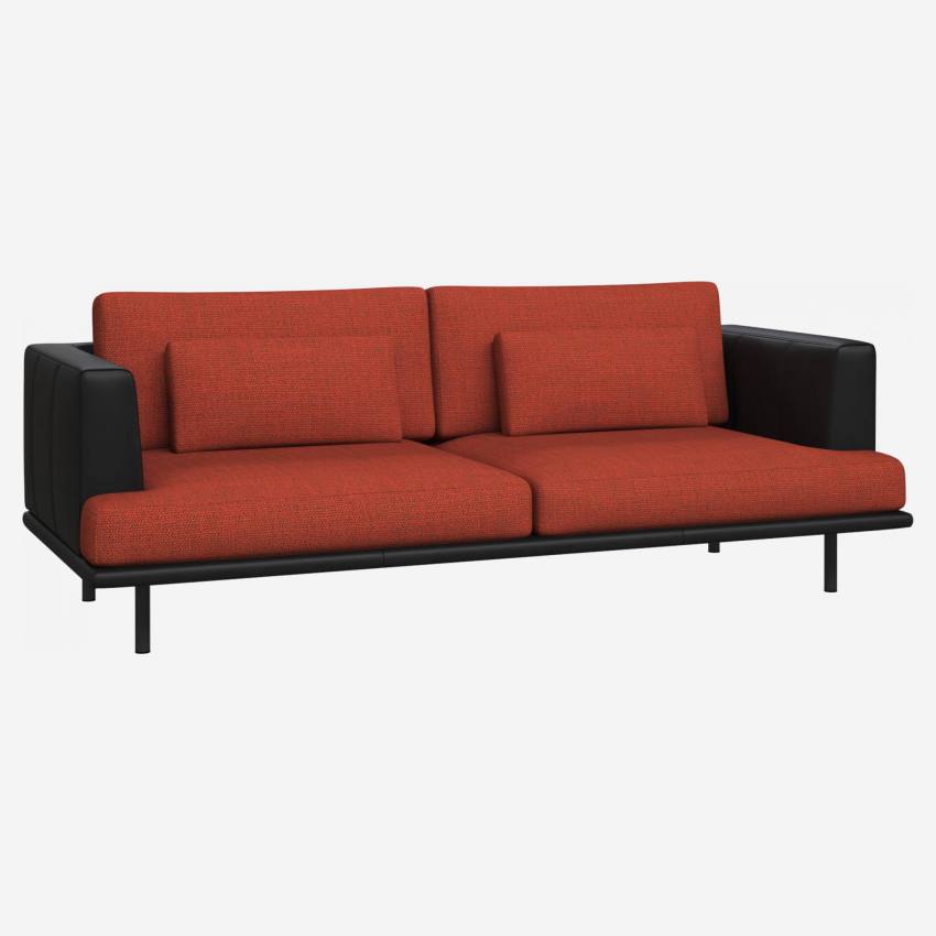 3 seater sofa in Fasoli fabric, warm red rock with base and armrests in black leather