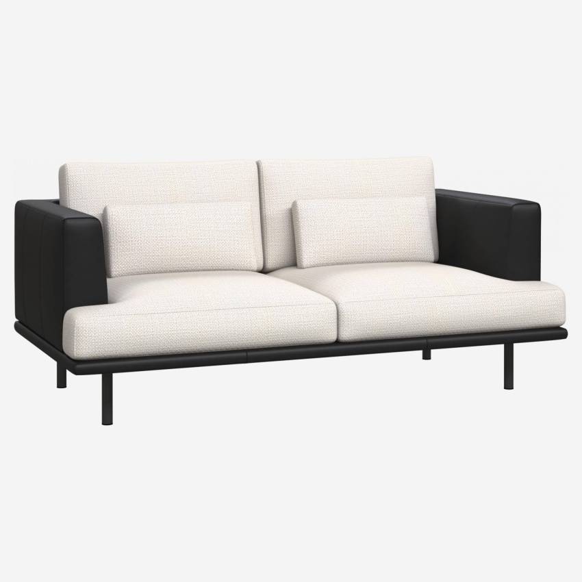 2 seater sofa in Fasoli fabric, snow white with base and armrests in black leather