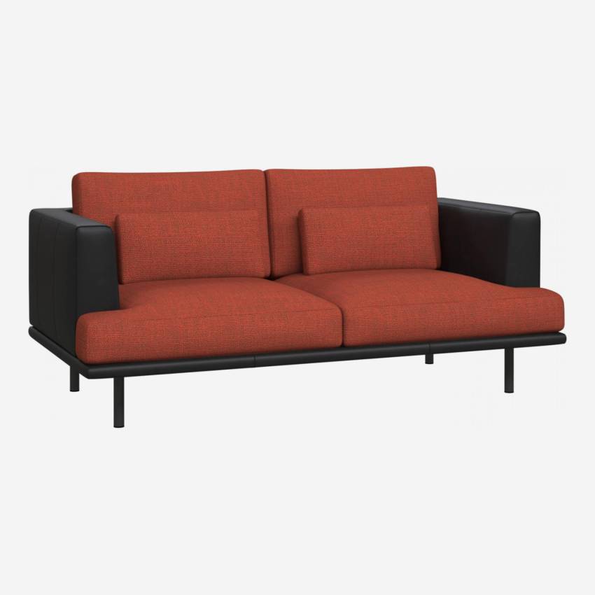 2 seater sofa in Fasoli fabric, warm red rock with base and armrests in black leather