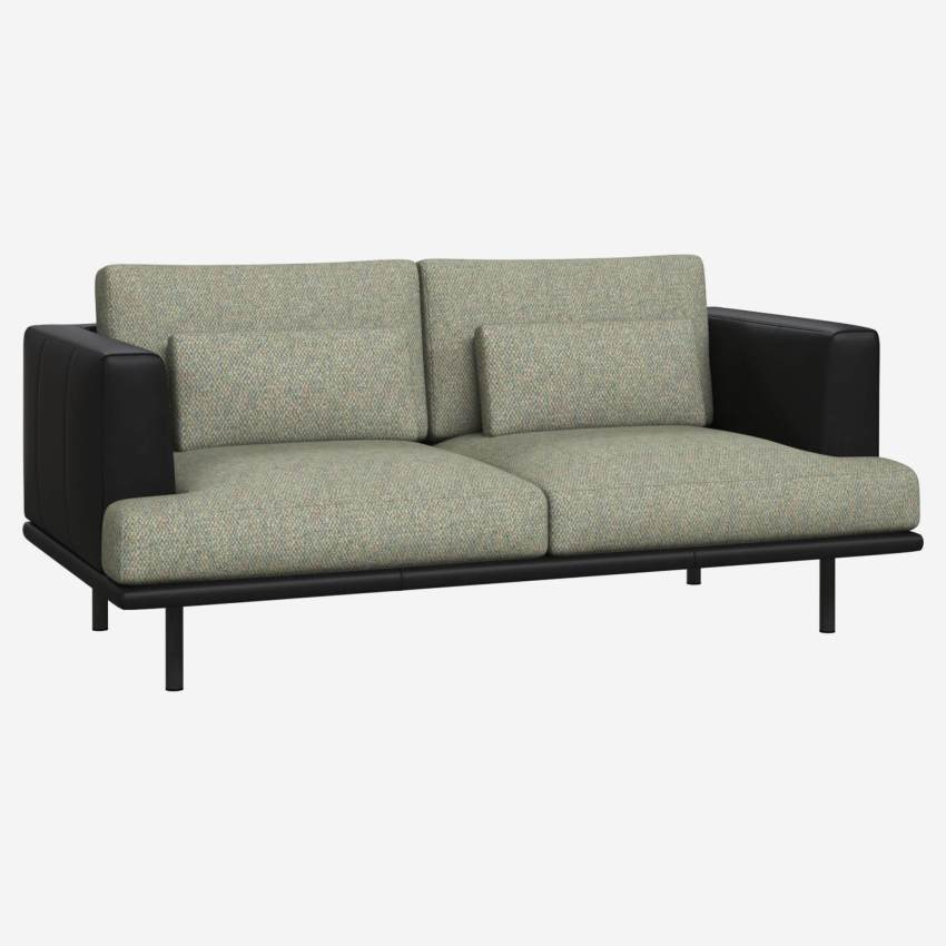2 seater sofa in Bellagio fabric, organic green with base and armrests in black leather