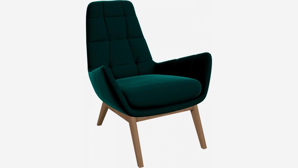 Armchair in Super Velvet fabric, petrol blue with oak legs