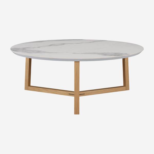 Table basse ronde en céramique avec effet marbre