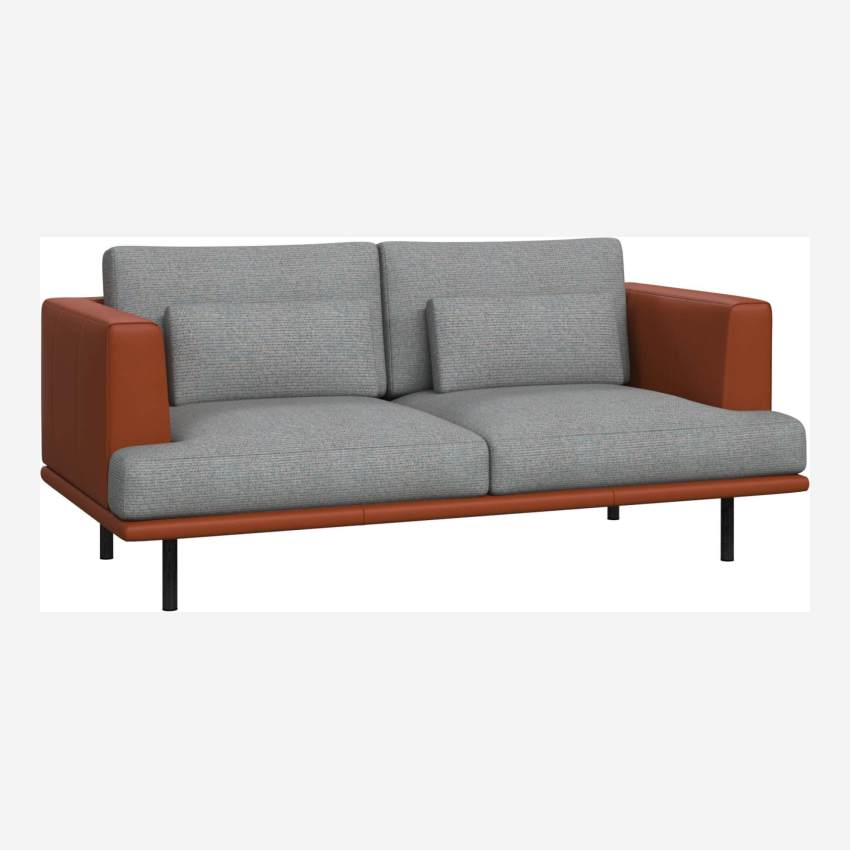 2 seater sofa in Lecce fabric, blue reef with base and armrests in brown leather