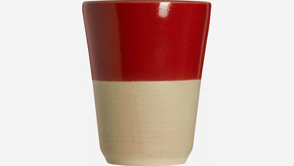 Small tumbler made in sandstone, natural and red