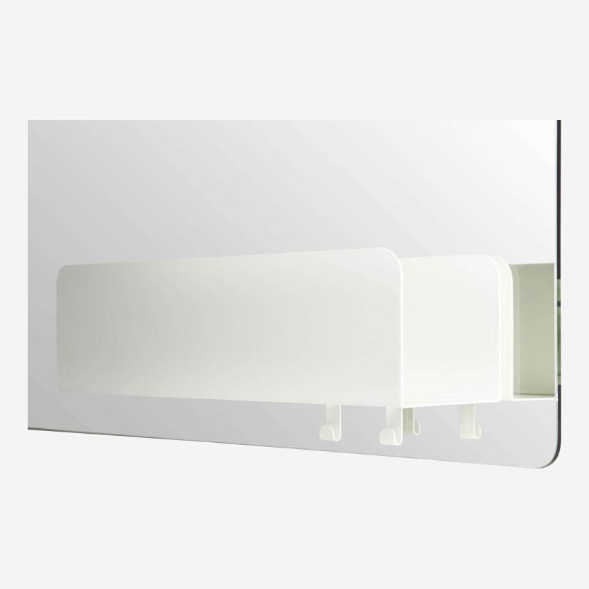 a mirror with a shelf