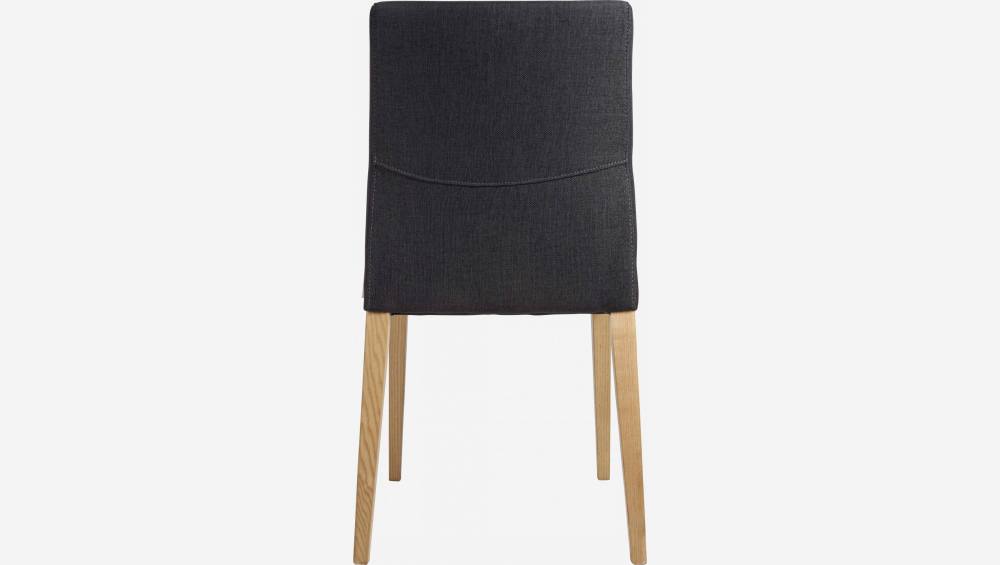 Dark grey fabric chair with ash legs
