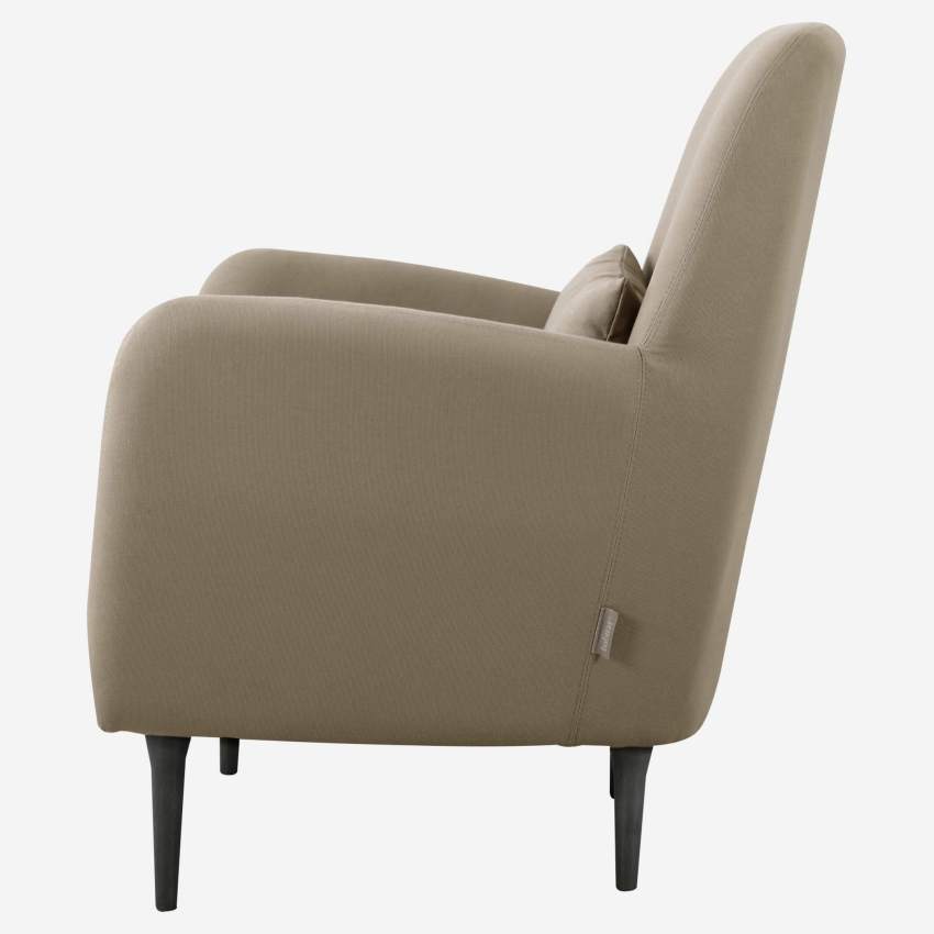 Beige fabric armchair with dark legs