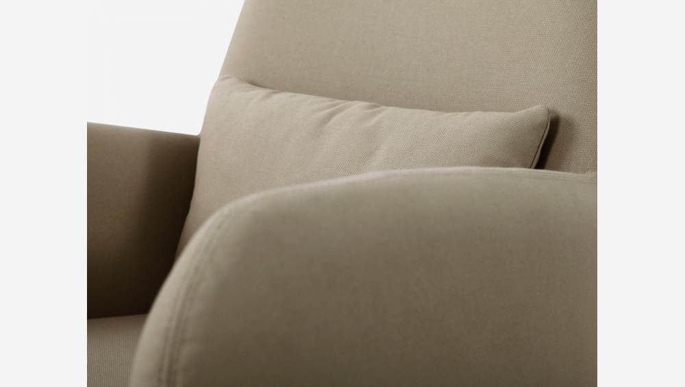 Beige fabric armchair with dark legs