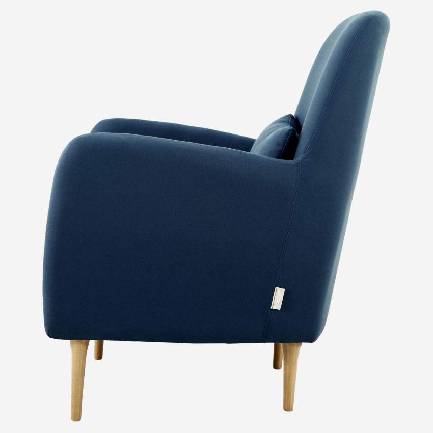 Blue fabric armchair with oak legs