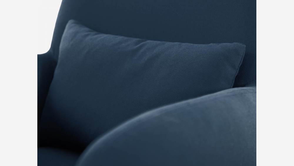 Blue fabric armchair with oak legs