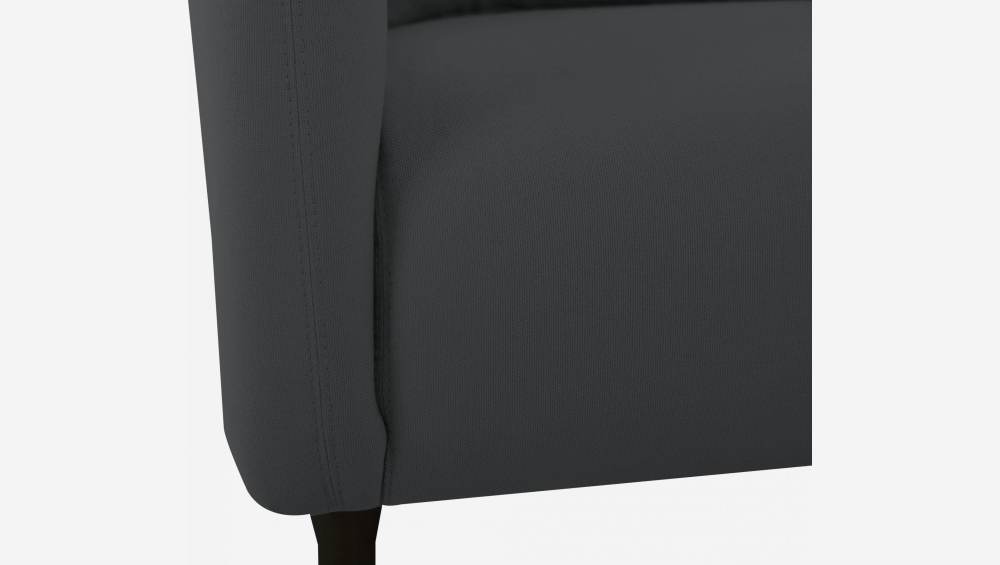 Anthracite grey fabric armchair with dark legs