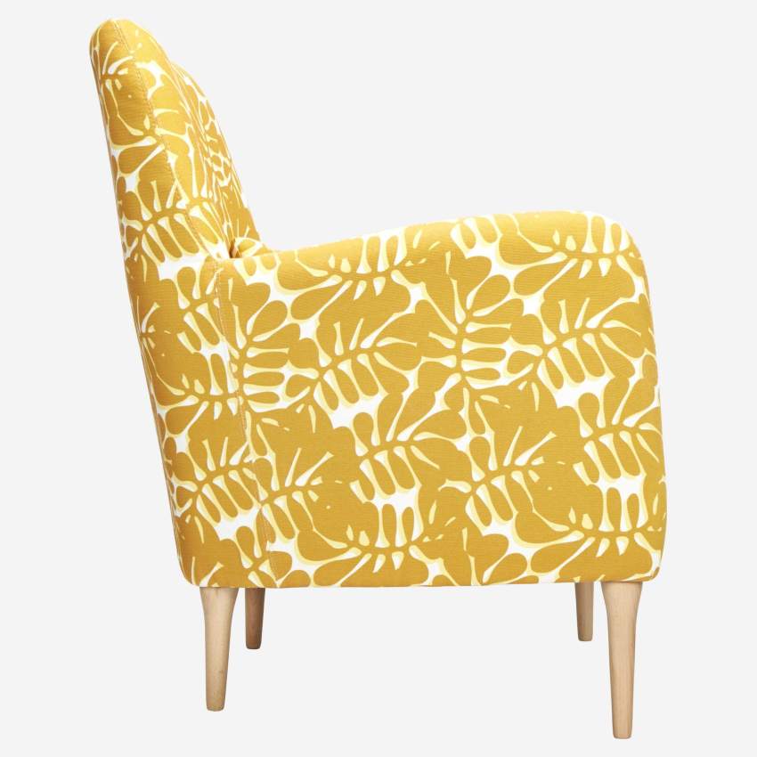 Yellow patterned armchair with oak legs