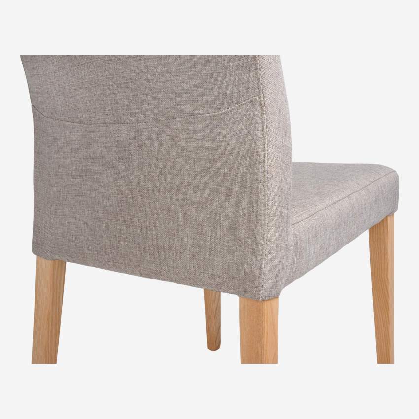 Beige fabric chair with ash legs