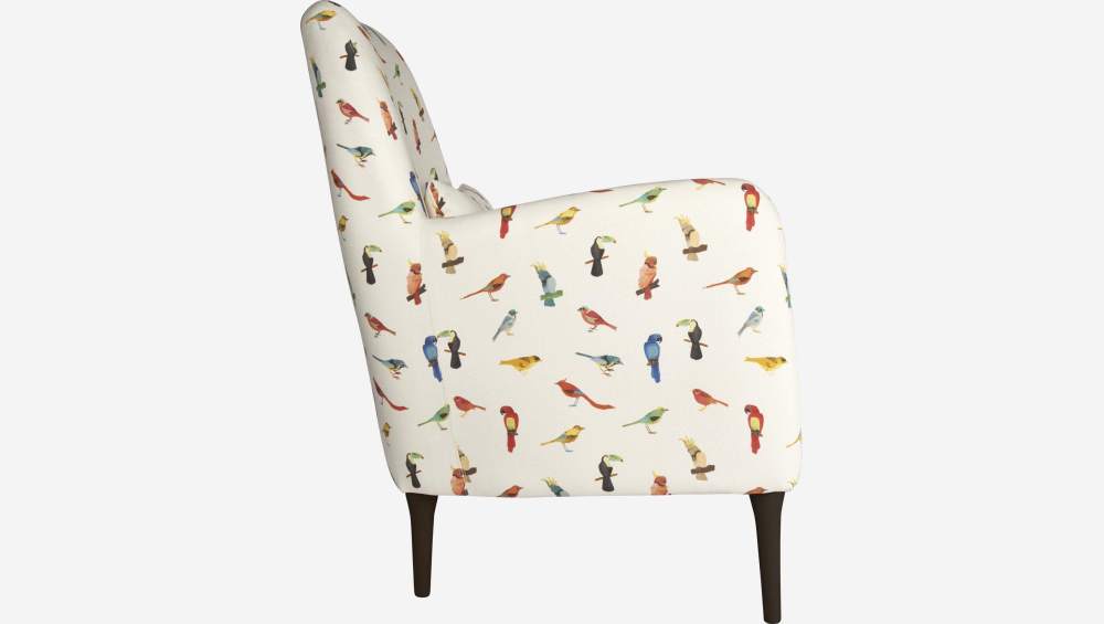 Bird motif fabric armchair with dark legs