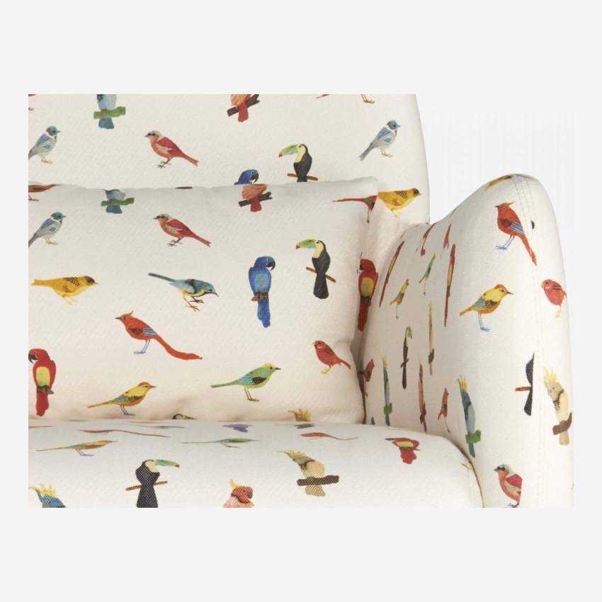Bird motif fabric armchair with oak legs