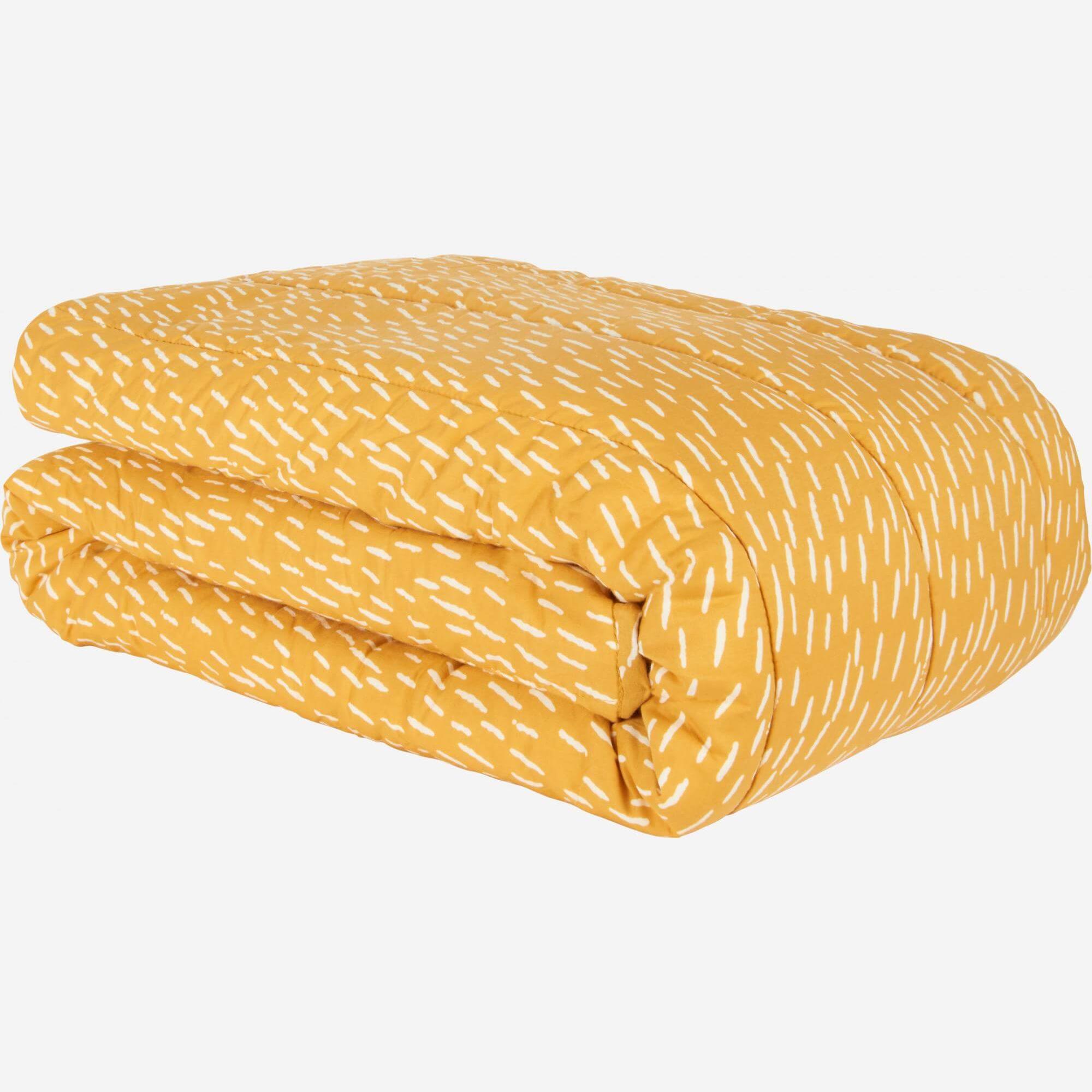 Bedspread, yellow with patterns